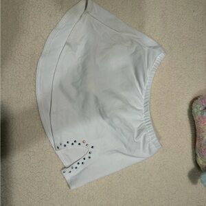 White Karisma figure skating skirt with touch of sparkles on side.